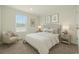 A serene bedroom with a cozy chair, soft linens, and matching bedside tables and lamps at 814 S Midway Hwy., Johnsonville, SC 29555