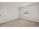 Neutral bedroom with plush carpet and a window that provides great natural light at 814 S Midway Hwy., Johnsonville, SC 29555