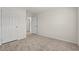 Cozy bedroom features neutral carpet and a glimpse into additional rooms at 814 S Midway Hwy., Johnsonville, SC 29555