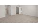 Spacious bedroom with carpeted floors and an open door leading to another room at 814 S Midway Hwy., Johnsonville, SC 29555