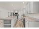 Well-equipped kitchen with white cabinets, stainless steel appliances, and a spacious center island at 814 S Midway Hwy., Johnsonville, SC 29555