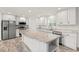 Bright kitchen with modern stainless appliances, granite counters, white cabinets, and wood-look floors at 814 S Midway Hwy., Johnsonville, SC 29555