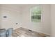 Functional laundry room features durable flooring, built-in storage, and ample natural light at 814 S Midway Hwy., Johnsonville, SC 29555