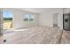 Bright, airy living room featuring wood-look floors, modern fixtures, and natural light with a neutral color palette at 814 S Midway Hwy., Johnsonville, SC 29555