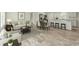 Open living space with hardwood floors, comfortable seating, and a dining area adjacent to a modern kitchen at 814 S Midway Hwy., Johnsonville, SC 29555