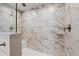 A modern shower with marble-style tiled walls, a sleek showerhead, and a glass enclosure at 814 S Midway Hwy., Johnsonville, SC 29555