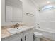 Modern bathroom featuring a granite sink, a toilet, and a tiled shower and tub at 820 S Midway Hwy., Johnsonville, SC 29555