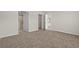 Bedroom with doorways to bathroom, closet, and hallway and neutral carpet at 820 S Midway Hwy., Johnsonville, SC 29555