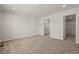 Spacious bedroom with neutral carpet, and doorways to a bathroom and walk in closet at 820 S Midway Hwy., Johnsonville, SC 29555