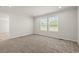 Bedroom featuring neutral carpet, and view of the outside from two windows at 820 S Midway Hwy., Johnsonville, SC 29555