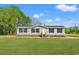 Charming single-story home with gray siding, black shutters, and a well-maintained lawn at 820 S Midway Hwy., Johnsonville, SC 29555