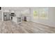 Bright, modern kitchen featuring white cabinets, stainless steel appliances, and a central island with breakfast bar at 820 S Midway Hwy., Johnsonville, SC 29555