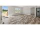 Bright living room with wood-look floors, fresh paint, and an exterior door at 820 S Midway Hwy., Johnsonville, SC 29555