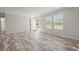 Bright living room with wood-look floors, fresh paint, and an exterior door at 820 S Midway Hwy., Johnsonville, SC 29555