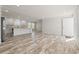 Open-concept living space featuring wood-look floors and access to the kitchen at 820 S Midway Hwy., Johnsonville, SC 29555