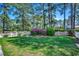 Well-maintained backyard with lush green grass and a white picket fence at 8261 Timber Ridge Rd., Conway, SC 29526