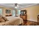 Spacious bedroom with a ceiling fan, hardwood floors and a large window for lots of light at 8261 Timber Ridge Rd., Conway, SC 29526