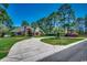 Beautiful single-Gathering home with a winding driveway and lush landscaping at 8261 Timber Ridge Rd., Conway, SC 29526