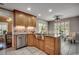 Charming kitchen island with stainless steel sink, granite countertop and wooden cabinets at 8261 Timber Ridge Rd., Conway, SC 29526