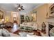 Spacious living room with hardwood floors, fireplace, ample seating, and access to other living spaces at 8261 Timber Ridge Rd., Conway, SC 29526