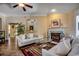 Welcoming living room featuring a fireplace, hardwood floors, comfortable furniture, and neutral decor at 8261 Timber Ridge Rd., Conway, SC 29526