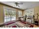 Relaxing sunroom with comfortable seating, pool view, and plenty of natural light for a peaceful retreat at 8261 Timber Ridge Rd., Conway, SC 29526