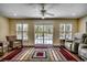 Bright sunroom with views of the pool, comfortable seating, and plenty of natural light at 8261 Timber Ridge Rd., Conway, SC 29526