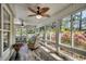 Bright and airy sunroom with wood flooring and natural views from ample windows at 8261 Timber Ridge Rd., Conway, SC 29526
