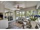 Inviting sunroom with comfortable seating, wood floors, and abundant natural light at 8261 Timber Ridge Rd., Conway, SC 29526