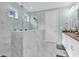 Luxurious bathroom with a frameless shower, marble tiles and modern fixtures at 8418 Cape Dutch Loop, Myrtle Beach, SC 29572