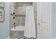 Cozy bathroom showcasing a tub with tile surround and built-in shelving at 8418 Cape Dutch Loop, Myrtle Beach, SC 29572