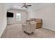 Spacious carpeted bonus room with ceiling fan, plush seating, and a window for natural light at 8418 Cape Dutch Loop, Myrtle Beach, SC 29572