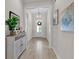 Welcoming foyer with decorative console table, art, and neutral color palette at 8418 Cape Dutch Loop, Myrtle Beach, SC 29572