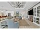Bright living room with tray ceiling and an open design that flows into other living spaces at 8418 Cape Dutch Loop, Myrtle Beach, SC 29572