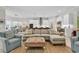 Spacious living room with comfortable seating, stylish decor, and wood-look tile flooring at 8418 Cape Dutch Loop, Myrtle Beach, SC 29572