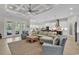 Open-concept living room boasts modern furniture and a seamless flow into the kitchen at 8418 Cape Dutch Loop, Myrtle Beach, SC 29572