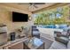 Inviting outdoor patio with comfortable seating, TV, mini fridge, and pool view at 8418 Cape Dutch Loop, Myrtle Beach, SC 29572