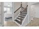 Elegant staircase featuring a modern design and wood-look flooring at 8418 Cape Dutch Loop, Myrtle Beach, SC 29572