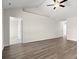 Spacious living area with hardwood floors and vaulted ceilings, offering ample natural light at 875 Owls Nest Dr., Conway, SC 29527