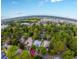 Expansive aerial view of a beautiful, wooded community near a lake, perfect for peaceful living at 915 Cedarwood Circle, Myrtle Beach, SC 29572