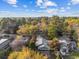 Aerial view of home showcasing mature trees and surrounding neighborhood at 915 Cedarwood Circle, Myrtle Beach, SC 29572