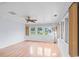 Sunlit living room with hardwood floors, neutral paint, and large windows showcasing the outdoor view at 915 Cedarwood Circle, Myrtle Beach, SC 29572