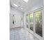 Sun room filled with natural light featuring large windows and vaulted ceiling at 915 Cedarwood Circle, Myrtle Beach, SC 29572