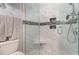 Modern bathroom featuring a stylish tiled shower with a glass door and multi-setting shower head at 101 Maddington Place Dr. # 103, Surfside Beach, SC 29575