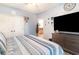 Spacious bedroom with a large TV on a dresser, creating a comfortable and functional living space at 101 Maddington Place Dr. # 103, Surfside Beach, SC 29575