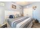 Comfortable bedroom featuring a queen-sized bed with stylish bedding and neutral walls with decor at 101 Maddington Place Dr. # 103, Surfside Beach, SC 29575
