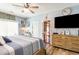 Bright bedroom with a ceiling fan, a large window, and ample storage space at 101 Maddington Place Dr. # 103, Surfside Beach, SC 29575