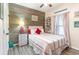 Charming bedroom featuring a cozy bed with rustic wood accent wall and beach-themed decor for a serene retreat at 101 Maddington Place Dr. # 103, Surfside Beach, SC 29575