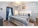 Cozy bedroom with a queen-sized bed, stylish linens, and beach-themed decor for a relaxing ambiance at 101 Maddington Place Dr. # 103, Surfside Beach, SC 29575