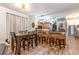 Bright dining area featuring a wooden table and stools for a casual, inviting atmosphere at 101 Maddington Place Dr. # 103, Surfside Beach, SC 29575